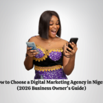 Nigerian business owner reviewing a digital marketing agency on a phone.